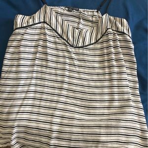 Striped black and white tank top with small cutout detail